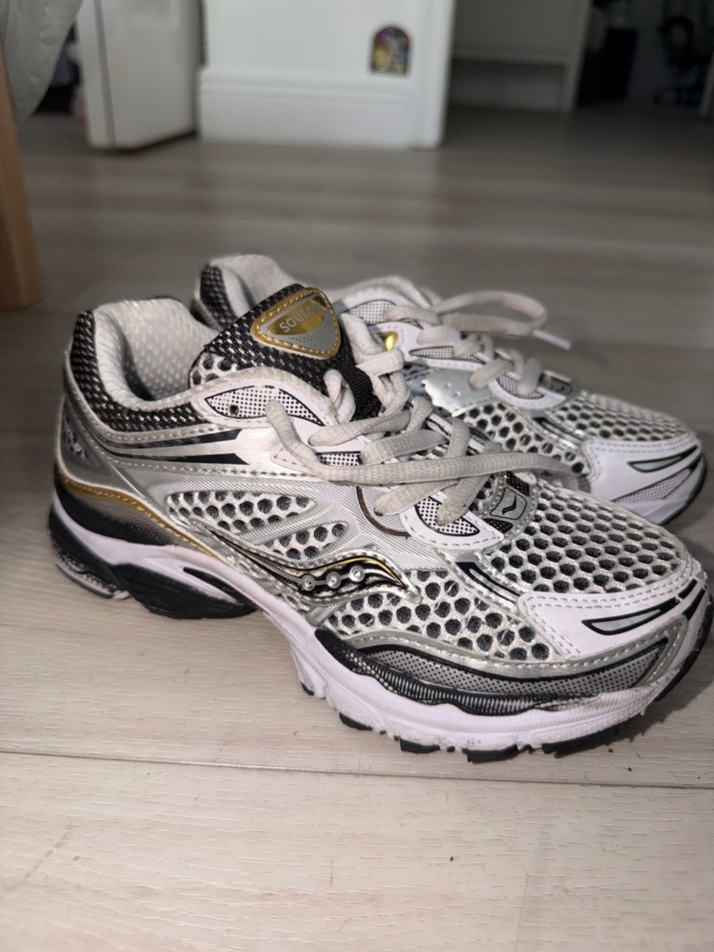 Saucony White and Gold Women’s Athletic Running Shoes